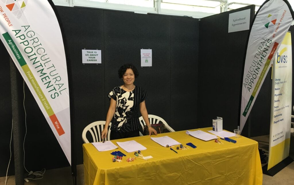 Woman at Agricultural Appointments career expo booth