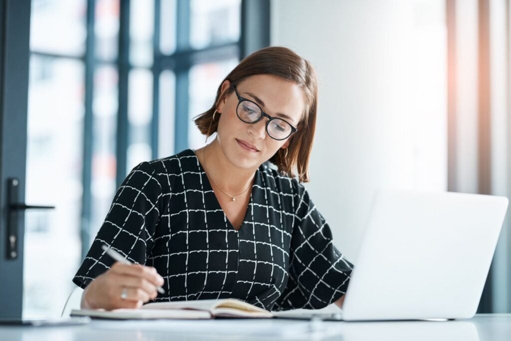 A person reviewing a career journal