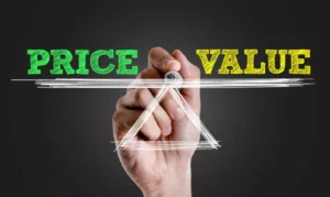 Hand drawing a scale with 'Price' and 'Value' balanced