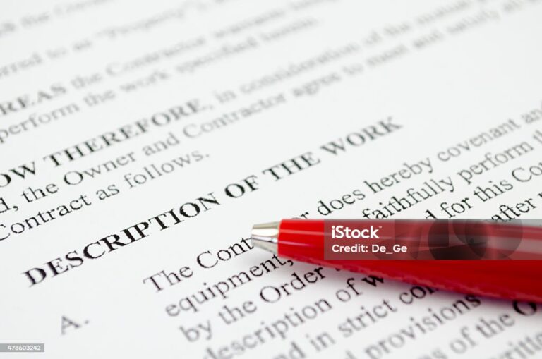 Red pen on contract document heading