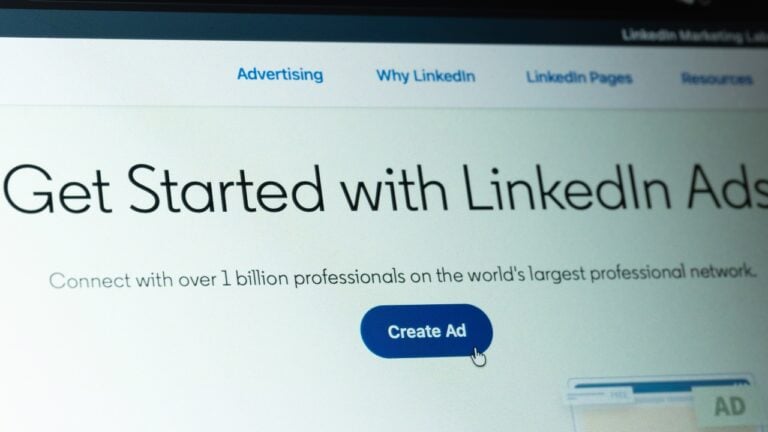 A close-up shot of a computer screen showing the "Get Started with LinkedIn Ads" page with a blue "Create Ad" button.
